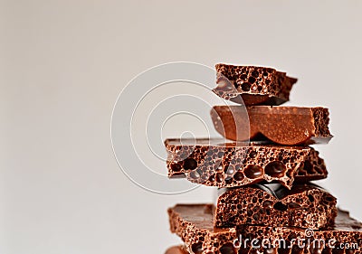 Sweet chocolate on a white background. isolated on white. porous chocolate texture Stock Photo