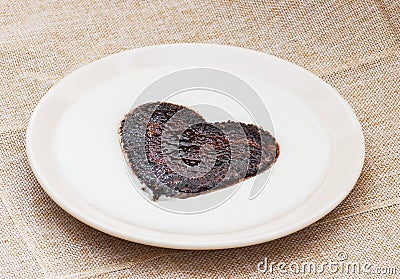 Sweet cocoa heart in the semolina pudding Stock Photo