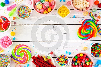 Sweet and colorful candy buffet frame, above view table scene over a white wood background Stock Photo