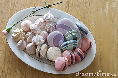 Sweet and colorful french macaroons or macaron in ceramic white Stock Photo