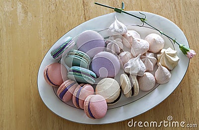 Sweet and colorful french macaroons or macaron in ceramic white Stock Photo