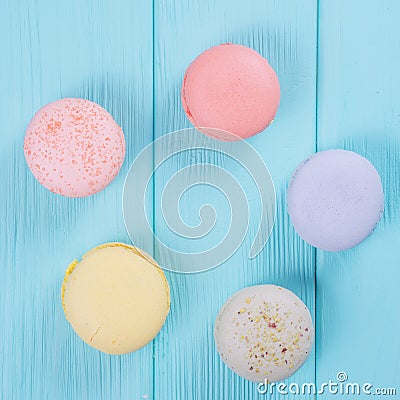 Sweet colorful macaroons on pastel blue background Stock Photo