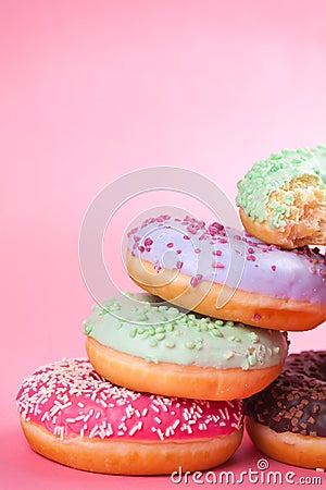 Sweet colorful tasty donuts on pink background. Stock Photo