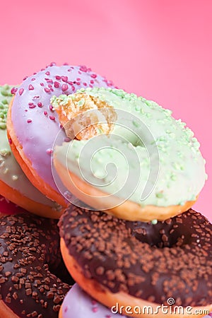 Sweet colorful tasty donuts on pink background. Stock Photo