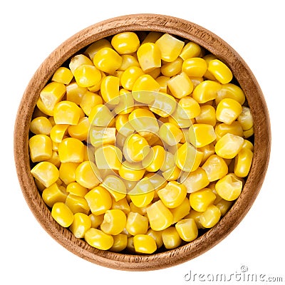 Sweet corn kernels in wooden bowl over white Stock Photo