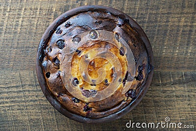 Sweet cottage cheese casserole with red cherry and semolina on wooden table. Ceramic bowl with baked cottage cheese casserole , Stock Photo