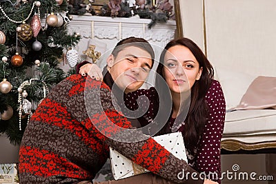 Sweet Couple in Winter Shirts Looking at Camera Stock Photo