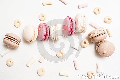 Sweet culinary art of macaroons on white backdrop Stock Photo