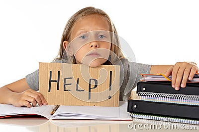 Cute blonde hair school girl holding a help sign in a education concept Stock Photo