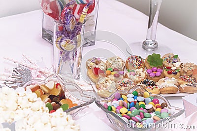 Sweet and delicious candy table with a lots of different candys and sweets Stock Photo