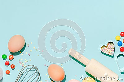 Sweet dessert concept, Various confectionery tools and candy macarons on light blue background Stock Photo