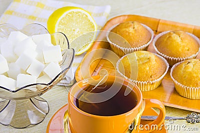 Sweet domestic cakes, tea, lemon and vase with sugar Stock Photo