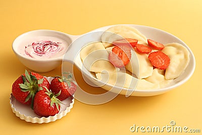 Sweet dumplings with cottage cheese and strawberries Stock Photo