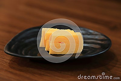 Sweet egg sushi or Tamago Yaki, Traditional Japaneses recipe Stock Photo