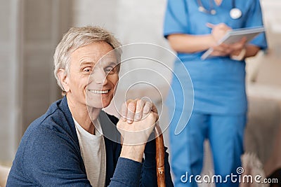 Sweet elderly man receiving some advice from doctor Stock Photo