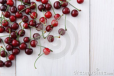 Sweet fresh cherries on white wood background Stock Photo