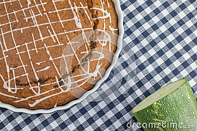 Sweet gingerbread zucchini Pie with lemon topping on blue checke Stock Photo