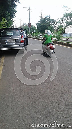 A sweet girl in green dress driving motorcycle Editorial Stock Photo