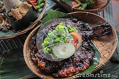 Sweet grilled gurame with vegetable slices Stock Photo