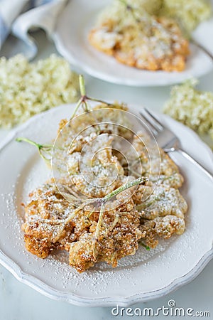 Sweet home made fried elderflowers in pancake Stock Photo