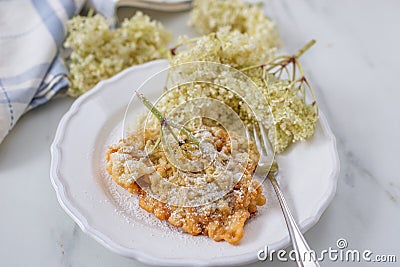 Sweet home made fried elderflowers in pancake Stock Photo