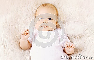 Sweet infant lying on the bed Stock Photo