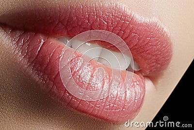 Sweet kiss. Perfect natural lip makeup. Close up macro photo with beautiful female mouth. Plump full lips Stock Photo