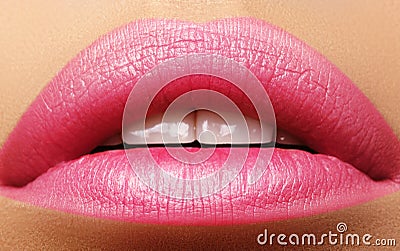 Sweet kiss. Perfect natural pink lip makeup. Close up macro photo with beautiful female mouth. Plump full lips Stock Photo