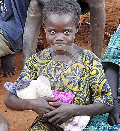 Sweet little African girl overjoyed with first soft toy Editorial Stock Photo