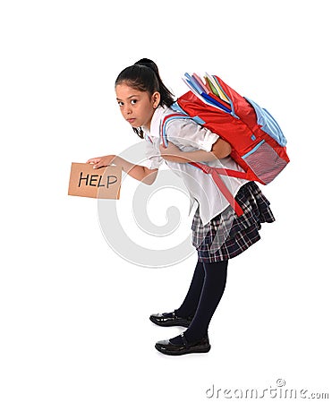 Sweet little girl carrying very heavy backpack or schoolbag full of school material Stock Photo