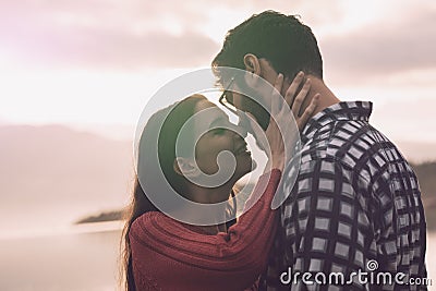 Sweet loving couple kissing at the lake Stock Photo