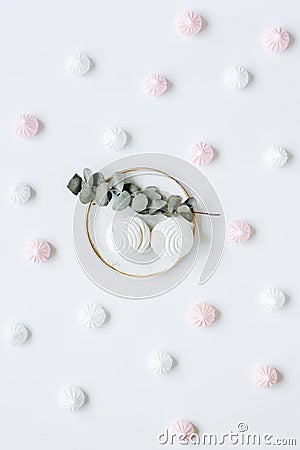 Sweet lunch with marsh-mallow and spring flowers for woman on white background top view pattern Stock Photo