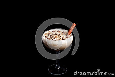 Sweet Milkshake with caramel syrup,cream liqueur,chocolate powder on black background Stock Photo