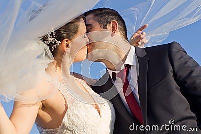 Sweet Newly Married Couple Kissing Outdoor Stock Photo
