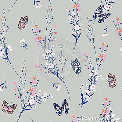 Sweet pastel Meadow flowers blowing in the wind with butterflies Stock Photo