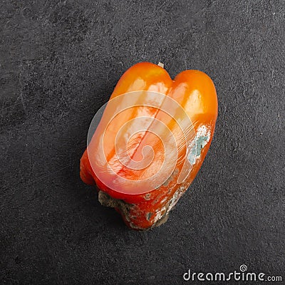 Sweet pepper with sooty mold fungi on a black background Stock Photo