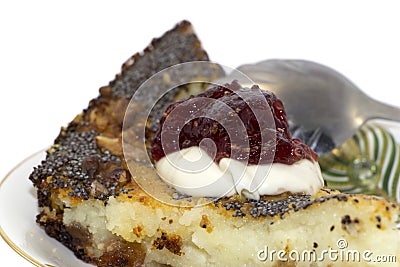 Sweet piece of pie with poppy seeds on a saucer Stock Photo