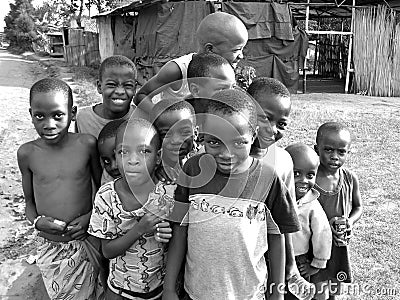 Sweet playful cheeky African children smiling for first photo Editorial Stock Photo