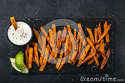 sweet potato roasted with smoked paprika served with garlic yogurt sause. Stock Photo