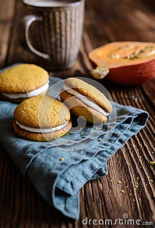 Pumpkin sandwich cookies stuffed with cream cheese Stock Photo