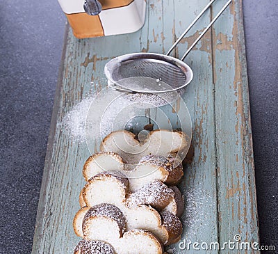 Sweet raisen bread with strainer and sugar Stock Photo