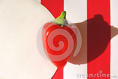 Sweet red bell pepper on a striped red-white background , concept sweet pepper festival , Minimal style Stock Photo