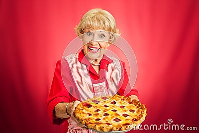 Granny Holding Lattice Top Cherry Pie Stock Photo