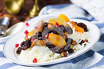 Sweet rice plov with dried fruits and nuts Stock Photo