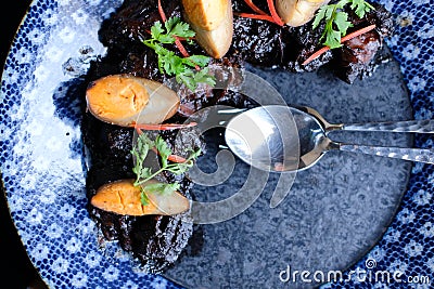 Sweet savory stewed pork & egg with chinese herb spices Stock Photo