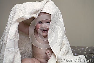 Sweet small baby with towel Stock Photo