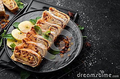 Sweet Strudel with apples and dried fruits. Top view, free copy space Stock Photo