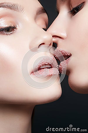 Sweet sugar kiss. two girls are kissing Stock Photo
