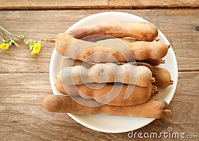 Sweet tamarinds in white disk. Stock Photo