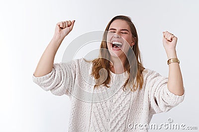 Sweet taste victory. Portrait very happy attractive celebrating young woman jumping happiness win raising clenching Stock Photo
